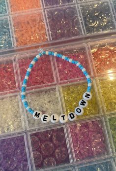 This is a handmade Niall Horan Themed beaded bracelet inspired by Meltdown!! This bracelet features a mixture of blue beads and white beads with Meltdown written in writing.  This bracelet is an needed accessory for any Niall fan and his upcoming tour!!  This bracelet is around 9cm on either side on a bead board so roughly 18cm. If you would like a smaller or larger size then please let me know and I can make it for you! Niall Horan Tour, Brick Stitch Pattern Earring, Niall Horan Baby, Concert Ideas