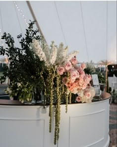 flowers and greenery are on display at an event