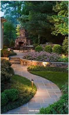 an outdoor patio with stone steps and landscaping