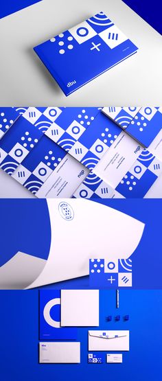 the blue and white stationery is laid out on top of each other