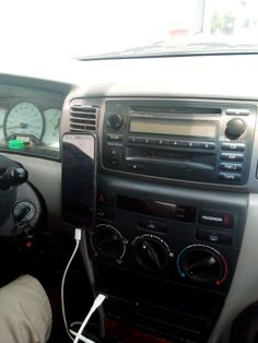 the interior of a car with radio and dash board