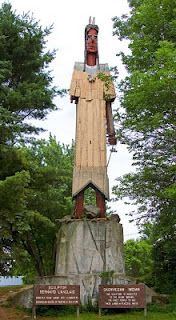 a statue in the middle of a park