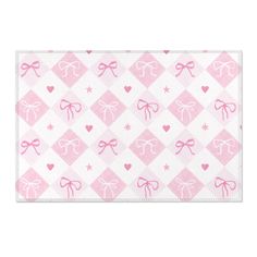 a pink and white checkered table cloth with hearts, bows and stars on it