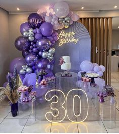 purple and silver balloons are on display at the 30th birthday party