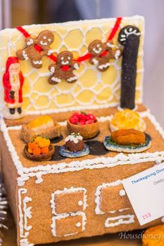 a gingerbread house is decorated with cookies and other treats