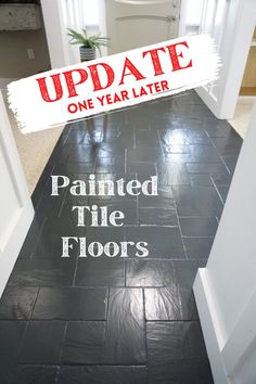 a black tile floor with the words update painted on it and an updating sign