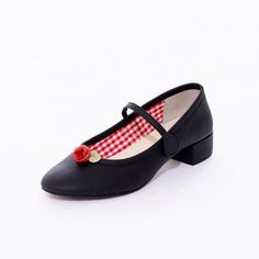 PREORDER: Expected to ship in November. Pay 25% now, and the remainder will be charged when they ship. The ultimate classic Mary Jane, made perfectly in soft nappa leather and topped with a pretty handmade leather rosette, a la Kitteny style. We love our details - lined in red gingham, cushy insoles, panel at the heel to prevent blisters, leather binding around the top, and our paw print soles. Straps have elastic on the inside and a velcro closure on the outer side of the shoe.Sustainability/et Spring Court Shoes With Red Sole And Round Toe, Spring Mary Jane Court Shoes With Rubber Sole, Classic Leather Shoes With Heel Strap For Spring, Classic Spring Leather Shoes With Heel Strap, Classic Court Shoes With Red Sole, Spring Court Shoes With Flat Heel And Red Sole, Leather Court Shoes With Red Sole, Leather Court Shoes With Red Sole And Round Toe, Prevent Blisters