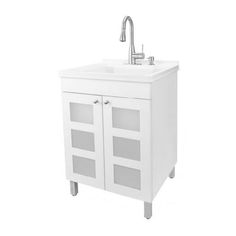 a white bathroom sink sitting under a faucet on top of a cabinet next to a faucet