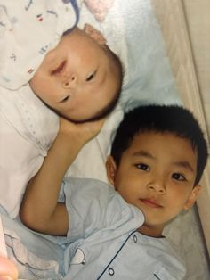 two young children laying next to each other