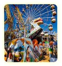 an amusement park with ferris wheel and rides