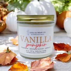 a jar of vanilla pumpkin sugar surrounded by fall leaves