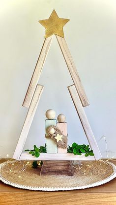 a cake that is sitting on top of a wooden table with a star above it