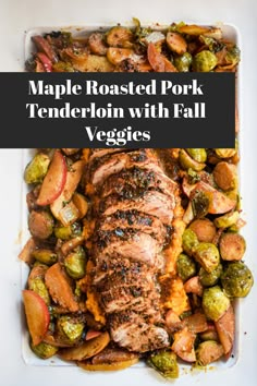 pork tenderloin with fall veggies on a white platter and text overlay reads maple roasted pork tenderloin with fall veggies