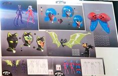 an assortment of cartoon character designs displayed on a wall