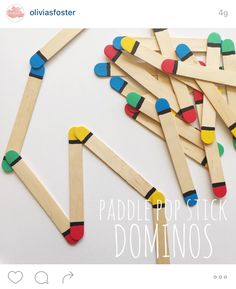 popsicle stick dominos are arranged on top of each other in different colors and shapes