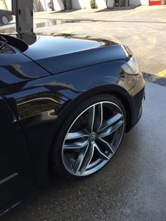 a black sports car parked on the street