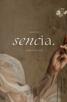 a woman holding a flower in front of her face with the words, sendia