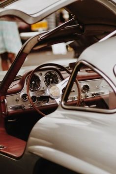 the interior of an old car is clean and ready for people to ride in it