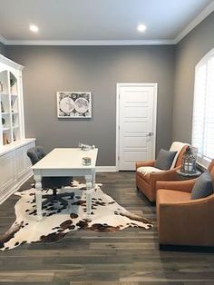 the living room is clean and ready for guests to use it as an office space