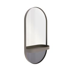 an oval mirror mounted to the side of a wall