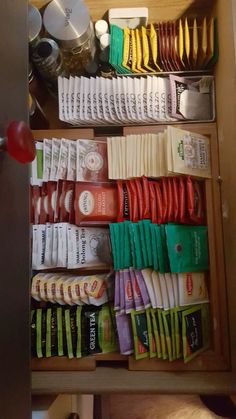 an open drawer filled with lots of different types of food and condiments on it