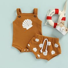 Looking for a perfect summer outfit for your little one? The Seashell Set is just what you need! Made from soft and breathable waffle knit material, this set will keep your baby cool and comfortable in the summer heat. The set comes in a stylish design that is perfect for any occasion. Get the Gourbear summer look today and make your baby the most stylish and comfortable one in town!✔️ Soft and comfortable fabric that's gentle on baby's skin.✔️made with soft high-quality print✔️ Two-piece set fo Romper With Sweater, Print Outerwear, Party Photoshoot, Perfect Summer Outfit, Printed Rompers, Summer Baby, Knit Set, Short Rompers, Sweater And Shorts