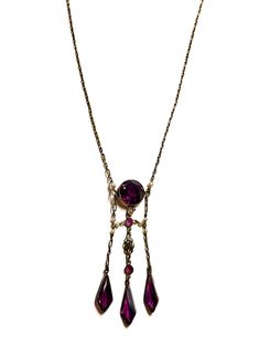 Beautiful early 1900s, Edwardian era negligee necklace.  The pendant portion of the necklace has a round bezel set, faceted purple glass stone hanging from a fine brass chain and is embellished with three bezel set dangling faceted drops and tiny faux pearls. This is a very well made necklace and absolutely gorgeous.  It would be a wonderful gift or a great way to pamper yourself or someone special.  The necklace measures 17" in length and the pendant portion is 2.75" long.   The overall conditi Vintage Briolette Necklace For Formal Occasions, Antique Drop Necklaces For Formal Occasions, Antique Round Purple Necklace, Vintage Drop Necklace For Formal Occasions, Antique Purple Necklace For Wedding, Vintage Purple Round Pendant Jewelry, Antique Purple Pendant Necklace, Vintage Amethyst Pendant Necklace, Vintage Purple Pendant Necklace