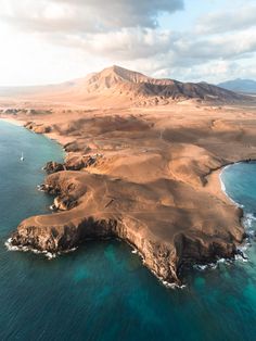 an island in the middle of some water