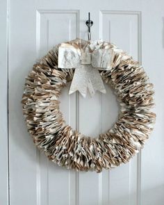 an image of a wreath made out of books on the front door with a bow