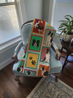 a chair with a dog blanket on it