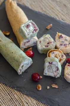 cranberry cream cheese pinwheels on a cutting board with text overlay