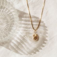 Our gorgeous keshi pearl necklace is the perfect everyday piece. A dainty pearl is suspended on a gorgeous box chain.   14k gold filled or sterling silver - perfect for everyday wear without tarnishing. AND they’re affordable. Find dainty necklaces, hoop earrings, dainty gold stacking rings, and more at Simple & Dainty! Everyday Gold Feminine Pearl Necklace, Gold Pearl Necklace For Everyday Feminine Style, Feminine Gold Jewelry With Pearl Charm, Feminine Everyday Gold Pearl Necklace, Everyday Feminine Gold Pearl Necklace, Chic Gold Necklaces For Wedding, Chic Gold Necklace For Wedding, Elegant 14k Gold Charm Necklace For Everyday, Chic Tarnish-resistant Charm Necklace Gift