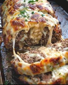 the meatloaf is stuffed with cheese and sauce