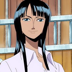 a woman with long black hair and blue eyes standing in front of a wooden wall