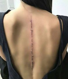 the back of a woman's neck with an inscription on it