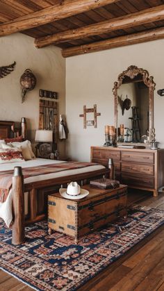 a bed sitting on top of a wooden floor next to a dresser under a mirror