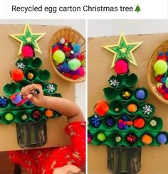 the child is playing with an origami christmas tree made out of plastic cups