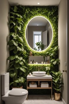 a white toilet sitting next to a bathroom sink under a mirror covered in green plants