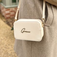 𝐌𝐚𝐤𝐞 𝐘𝐨𝐮𝐫 𝐌𝐚𝐫𝐤 Let our Personalised Script Name Faux Leather Handbag be the finishing touch to your look. It's the go-to for adding a personal twist to a sleek staple. 𝐂𝐫𝐚𝐟𝐭𝐞𝐝 𝐟𝐨𝐫 𝐘𝐨𝐮 Imagine your name in elegant 3D script on a handbag that feels as good as it looks--durable, yet with a touch of class that's unmistakably you. 𝐒𝐭𝐲𝐥𝐞 𝐟𝐨𝐫 𝐄𝐯𝐞𝐫𝐲 𝐒𝐜𝐞𝐧𝐞 Dress it up or down, this handbag swings both ways. It's your trusty sidekick for a day in town or that spe Cream Bag With Adjustable Strap As Gift, Cream Bag With Detachable Strap For Gift, Personalized Gift White Bag, Personalized Beige Rectangular Bag, Elegant Personalized Bags For Everyday Use, Elegant Rectangular Bag For Personalized Gift, Elegant Rectangular Bag As Personalized Gift, Elegant Rectangular Bags For Personalized Gifts, Personalized Pouch Bag For Everyday Use