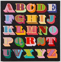 an alphabet made out of colored paper with the letters in different colors and shapes on it