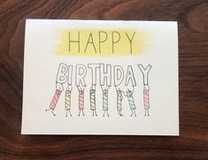 a happy birthday card with some candles on it and the words happy birthday written in yellow