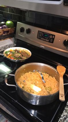 two pans of food are sitting on the stove