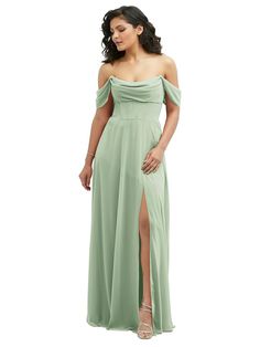 a woman in a long green dress with a slit down the side and one leg