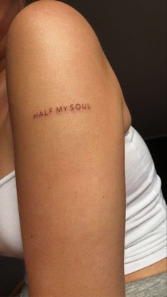 half my soul tattoo on the back of a woman's left arm and shoulder