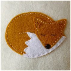 a close up of a patch with a fox on it