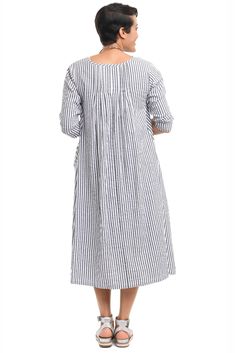 This super soft, comfortable dress has long sleeves, princess seams and pintuck details on the front and back. Side seam pockets make this the perfect dress. 100% Cotton Unlined Approximate Measurements in inches X-Small: Bust 38", Length 44.5 ", Small: Bust 40", Length 45" Medium: Bust 42", Length 45.5" Large: Bust 44", Length 46" X-Large: Bust 46", Length 46.5" XX-Large: Bust 48", Length 47" Striped Long Sleeve Relaxed Fit Dress, Striped Long Sleeve Dress With Relaxed Fit, Long Sleeve Striped Cotton Midi Dress, Relaxed Fit Long Sleeve Pleated Dresses, Long Sleeve Cotton Dress With Pintucks, Cotton Long Sleeve Dress With Pintucks, Relaxed Fit Long Sleeve Dress With Pleated Sleeves, Spring Long Sleeve Dress With Slip Pockets, Princess Seams