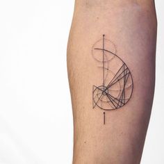 a person with a tattoo on their leg that has an image of a geometric object