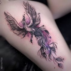 a woman's thigh with a bird tattoo on it