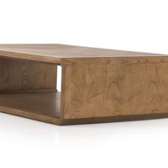 a wooden coffee table with two shelves on each side