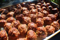 meatballs are being cooked in an oven